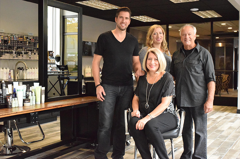 Daybreak Salon & Spa is owned by the Rushlow family, which includes Jerad Rushlow (left), Jenee Osborne, Gary Rushlow and Mary Toffoli Rushlow (front, center). Photo by Erica McClain